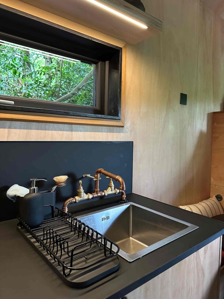 the taps and shower were assembled from copper piping. the seat cushions are ma 25